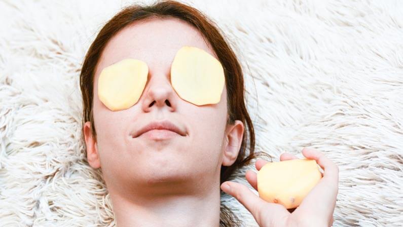 beautiful lady with potato on her eyes