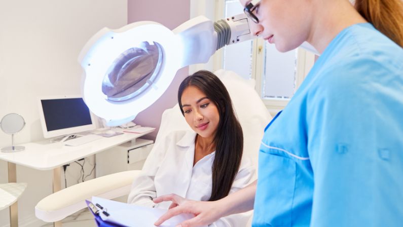 dermatologist showing results to patient